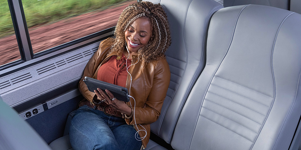 Woman sitting in coach class seat